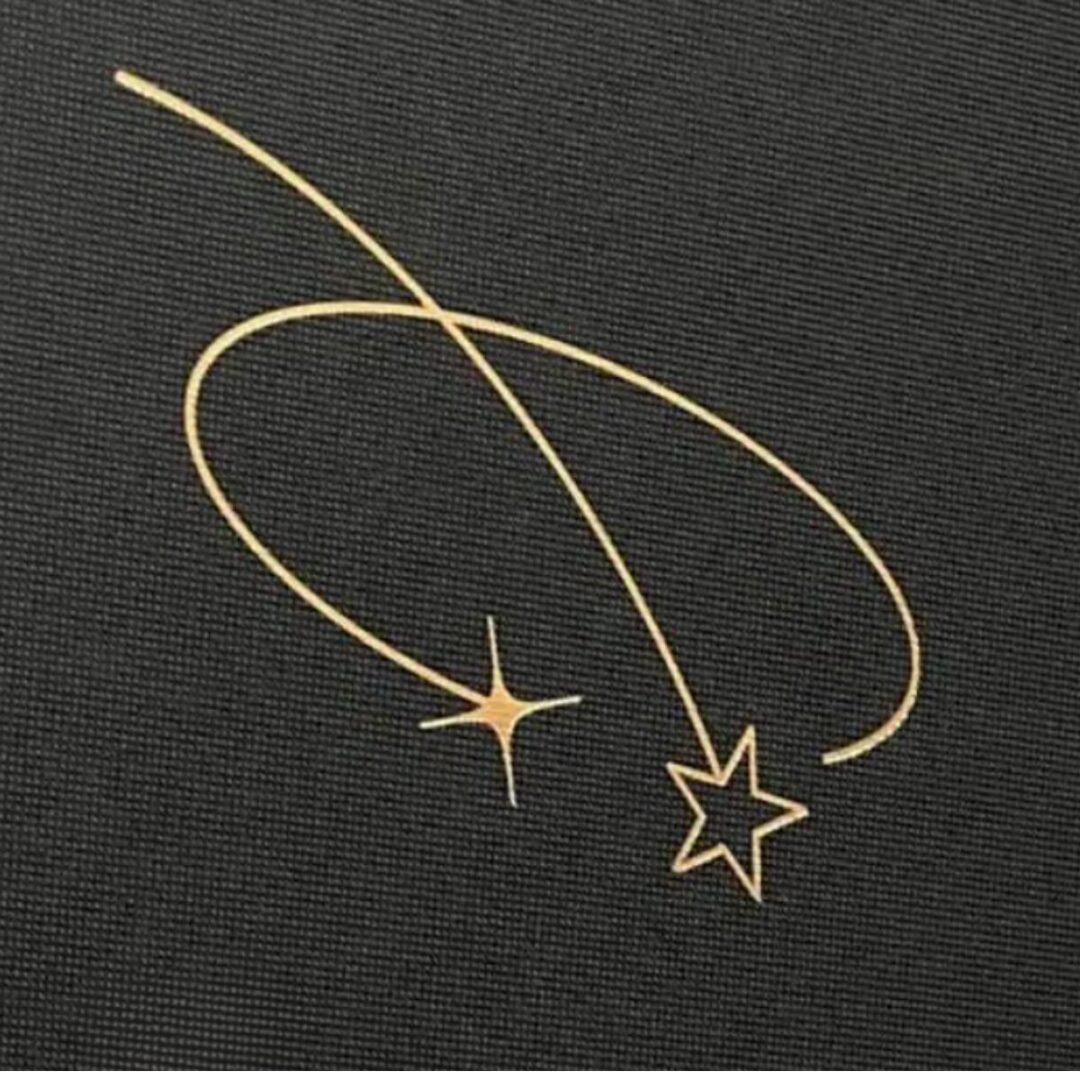 Gold shooting stars with trailing arcs